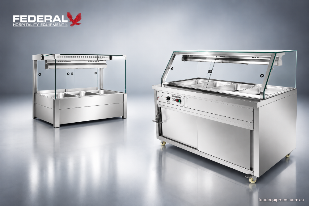 Two stainless steel commercial Bain Marie food warmers with multiple GN food pans, glass sneeze guards and overhead heating lamps for Australian hospitality kitchens.