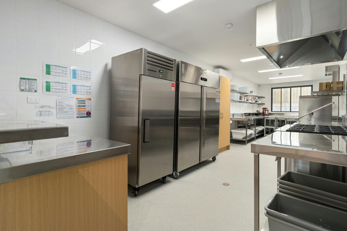 Commercial kitchen with stainless steel refrigerators